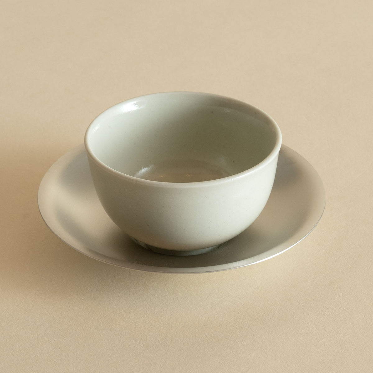 Porcelain Tea Cup and Pewter Plated Saucer