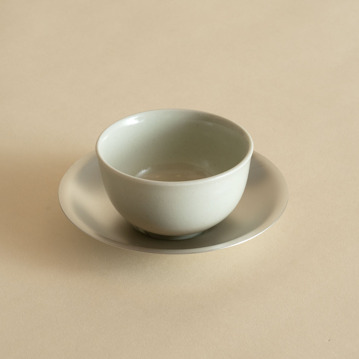 Porcelain Tea Cup and Pewter Plated Saucer