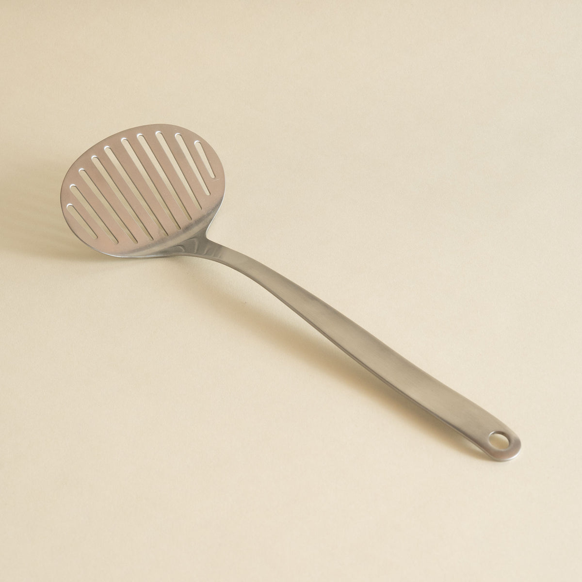 Sori Yanagi round stainless steel slotted spatula turner