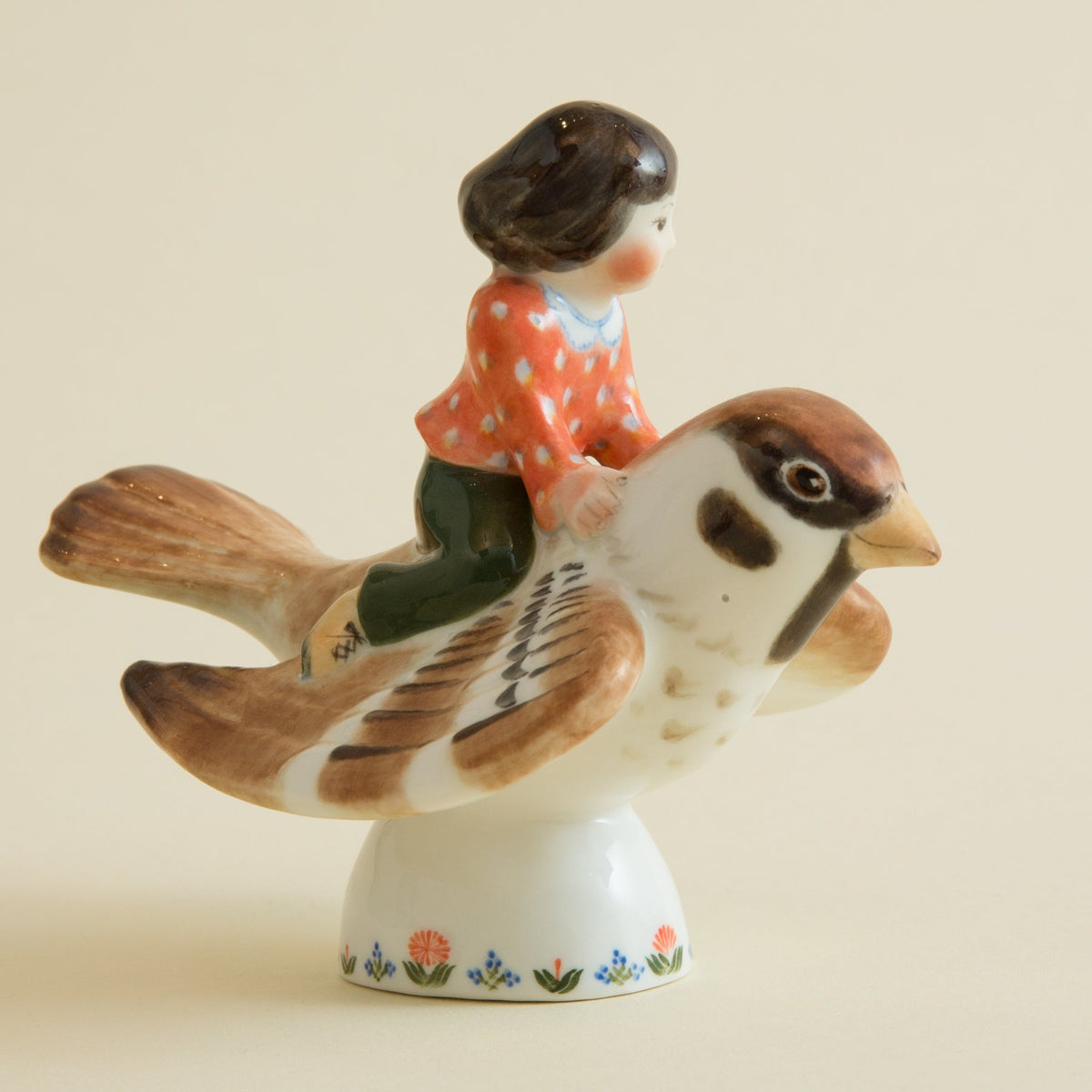 Child on a Sparrow FigurineFigurines