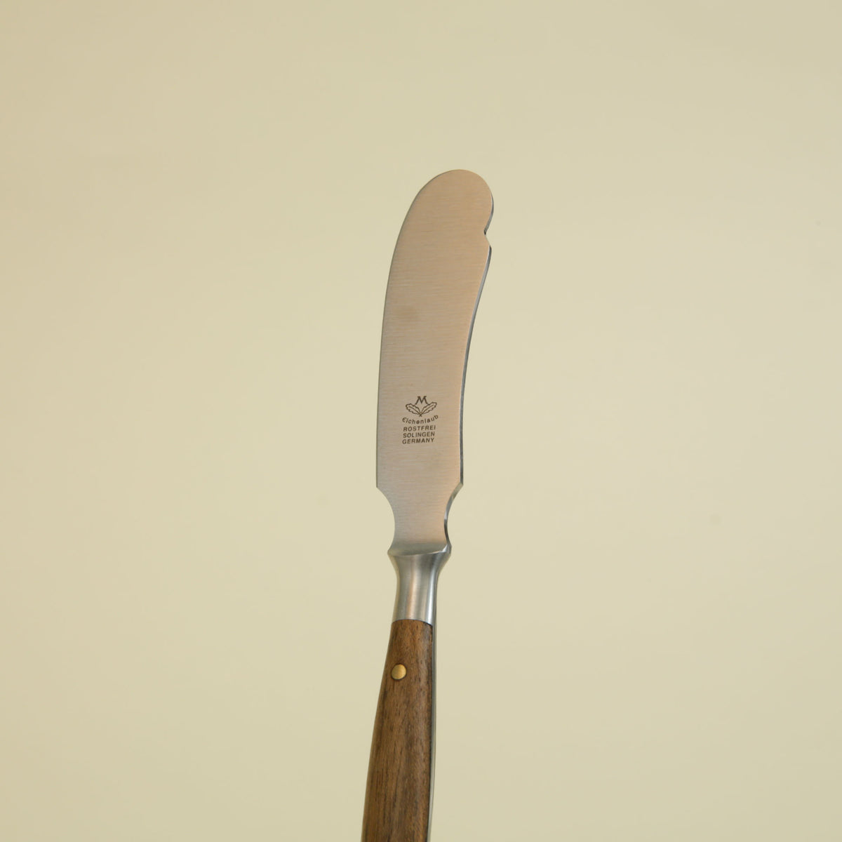 Eichenlaub hand-forged German butter knife with wooden handle and brass rivets