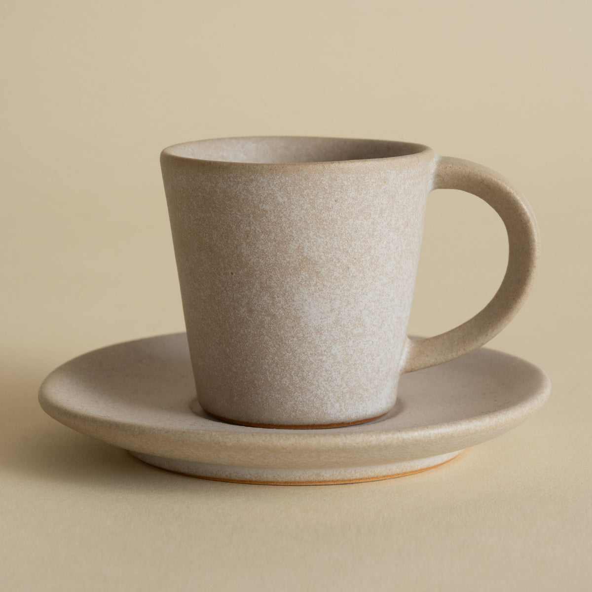 Handmade ceramic espresso cup and saucer in stone beige