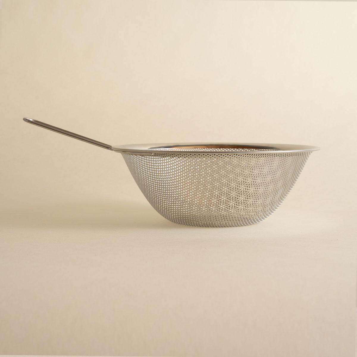 Sori Yanagi stainless steel colander with long handle from the side