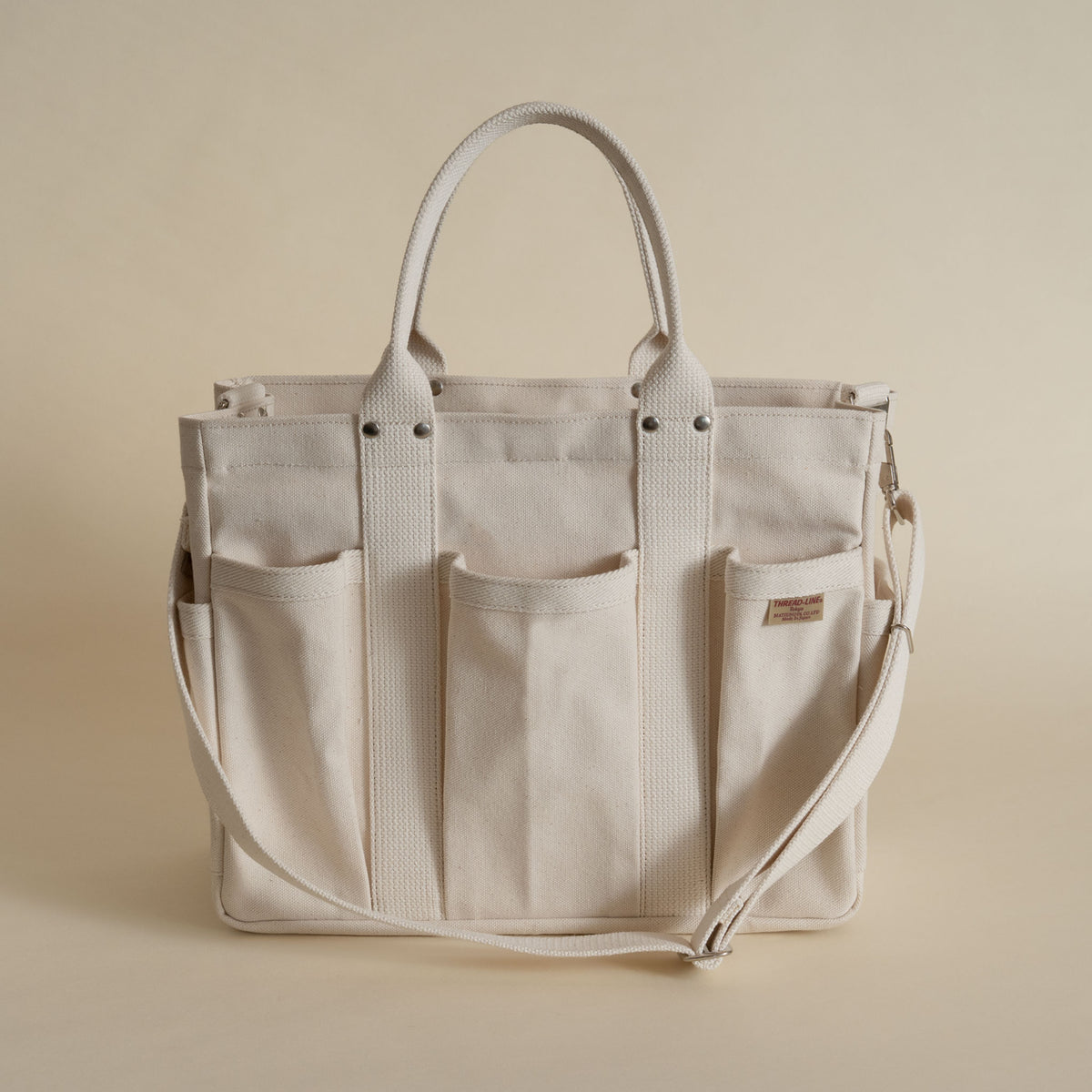 Threadline cotton canvas tool tote with shoulder strap in white